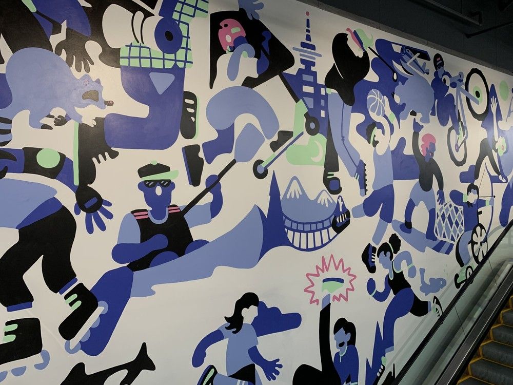 The store features a mural by Vancouver artist Andrew McGuire.