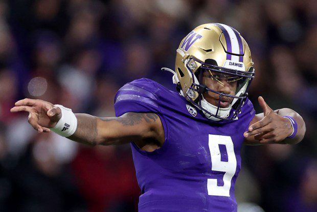 Michael Penix Jr. #9 of the Washington Huskies reacts after a first down against the Washington State Cougars during the fourth quarter at Husky Stadium on Nov. 25, 2023 in Seattle, Washington. (Photo by Steph Chambers/Getty Images)