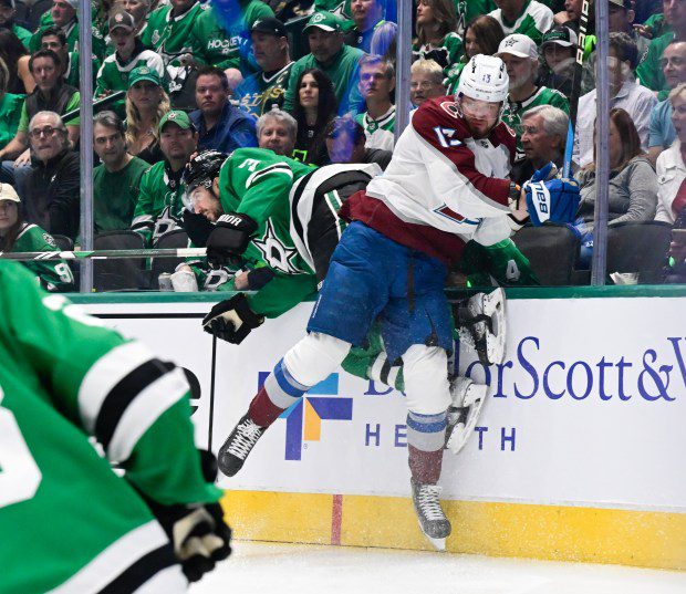 Colorado Avalanche right wing Valeri Nichushkin (13) and Dallas Stars defenseman Chris Tanev (3) crash the boards in the first period during game one of the second round of the 2024 NHL Stanley Cup Playoffs at the American Airlines Center in Dallas, Texas on Tuesday, May 07, 2024. (Photo by Andy Cross/The Denver Post)
